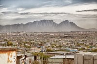 Khayelitsha, an informal settlement in Cape Town, with Table Mountain in the background