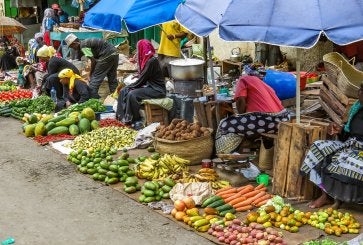 Women selling fresh fruits and vegetables at a market in Mombasa, Kenya.