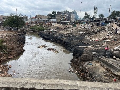 A demolished informal settlement along the riverbank in Nairobi.