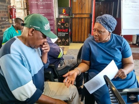 Two people discussing.