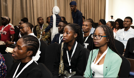Young people in a conference room.