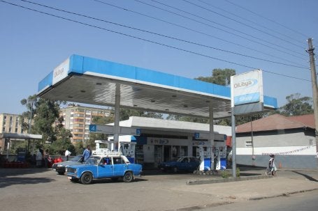 A Lada — a durable, boxy passenger car originally produced in Russia and still common in older transport fleets — gasses up at a fuel station in Addis Ababa.
