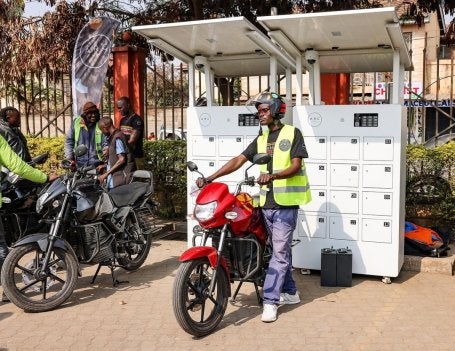 Riders swap batteries at an ARC Ride charging station. 