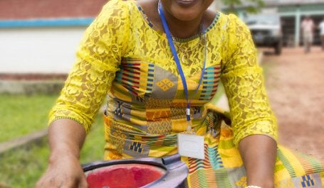A woman holding a fuel efficient stove