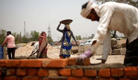 Brick layers during in a heatwave in New Delhi, India