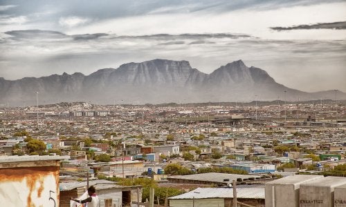 Khayelitsha, an informal settlement in Cape Town, with Table Mountain in the background