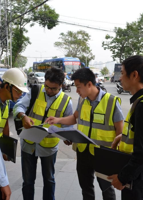 Urban planners wearing safety vests.